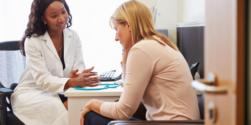 A women's health doctor meeting with a patient