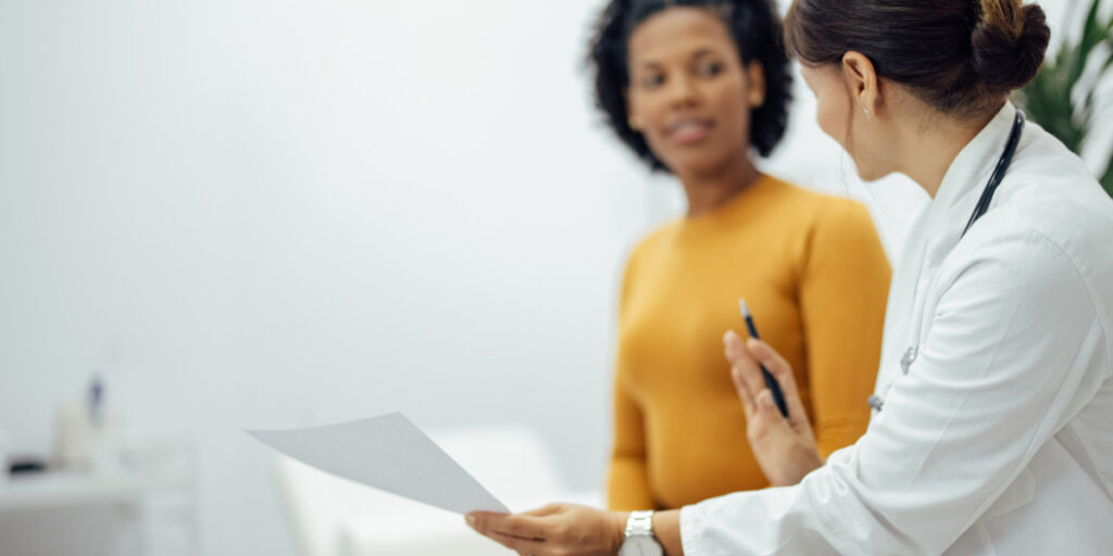 A gynecologist meeting with a patient