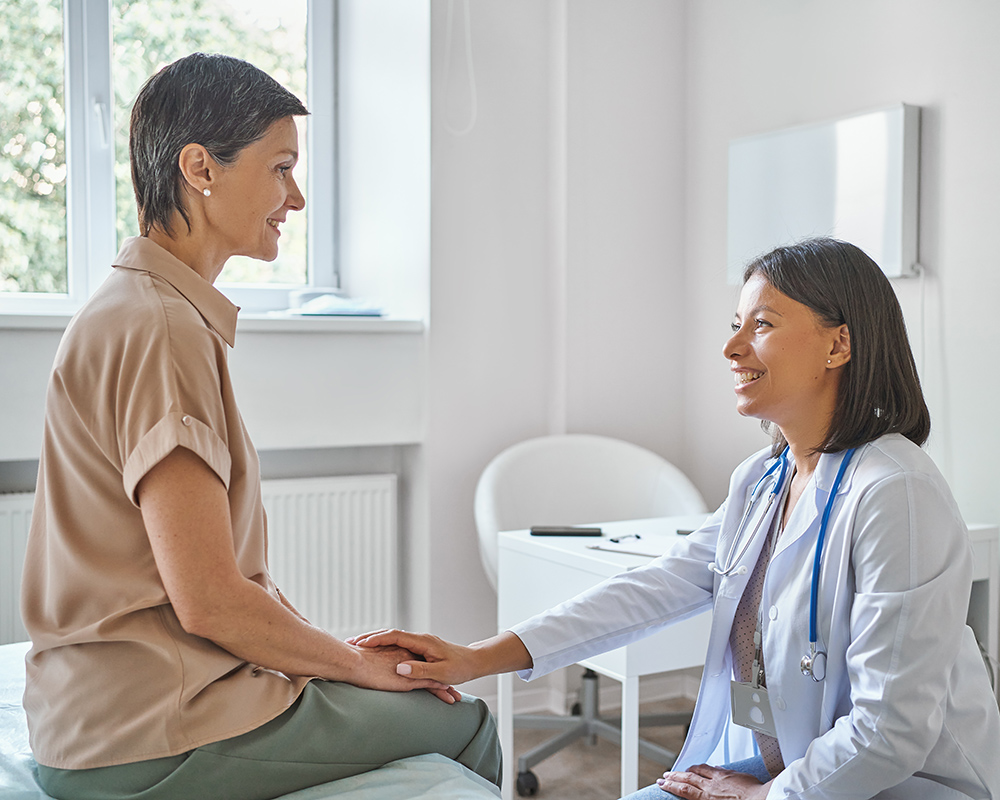 A gynecologist meeting with a patient