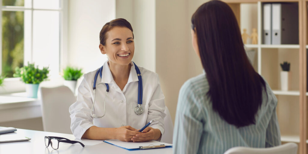 A women's health doctor meeting with a patient