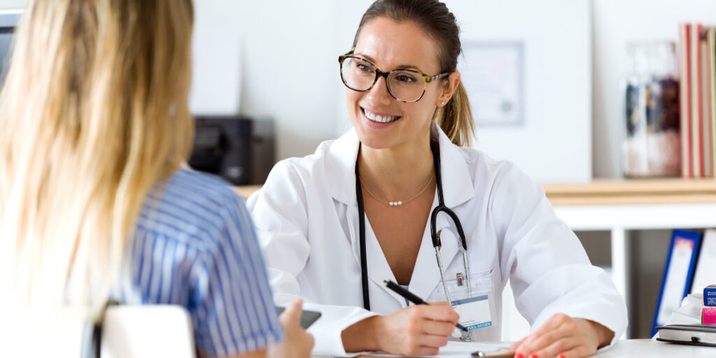 A gynecologist meeting with a patient